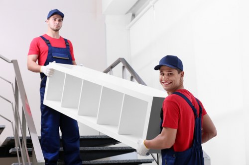 Local moving van handling furniture and boxes for a Belgravia relocation