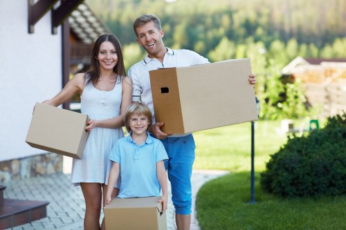 Packed moving boxes and furniture in a Belgravia home