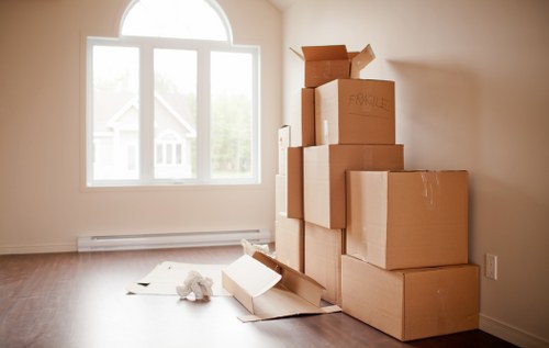 Moving team preparing items with protective equipment for a Belgravia relocation