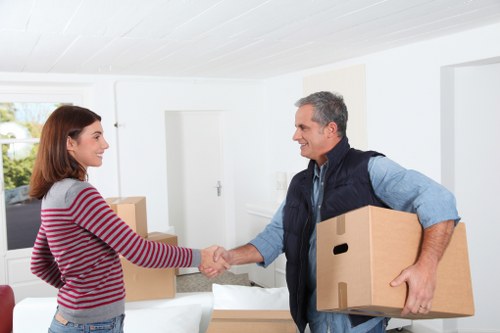 Team handling office equipment during a Belgravia business relocation