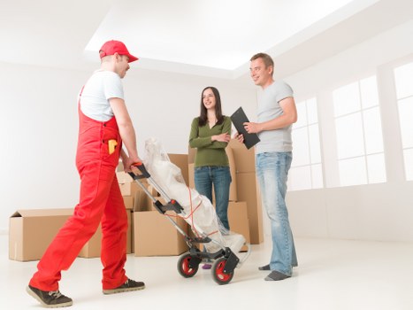 Boxes and office furniture prepared for a business move in central London